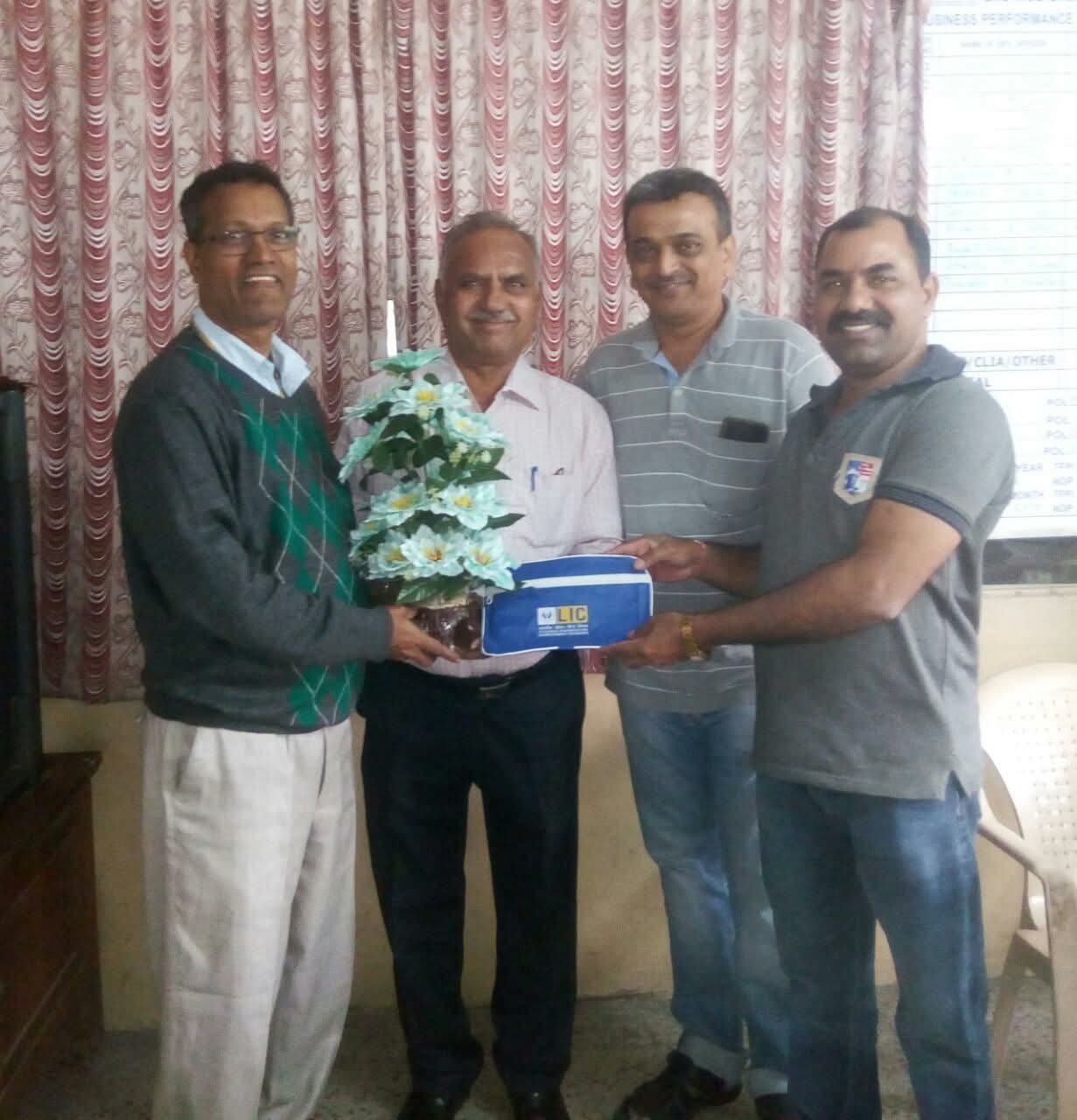 Ashok Desai with colleagues at a professional presentation